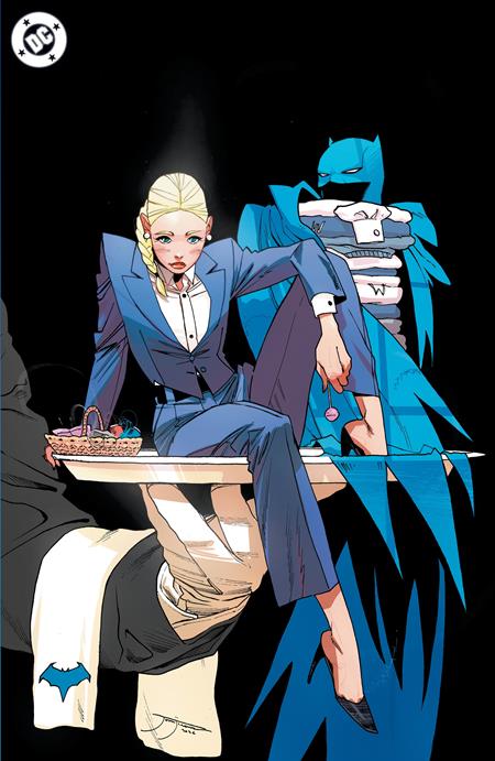 Comic book style illustration featuring a blonde woman in a blue suit seated on a table, with a Batman character in a blue and gray costume behind her against a black background. A DC logo is visible in the top-left corner.