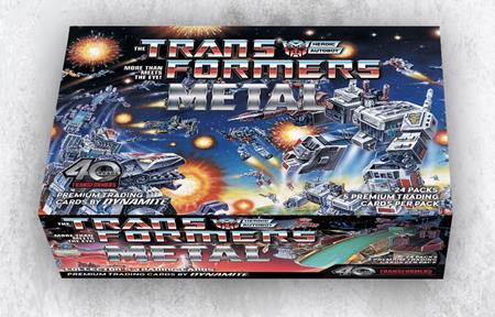 Transformers 40th Anniversary Metal Trading Cards Collector's Set Box by Dynamite Entertainment featuring Optimus Prime and other Transformers characters in a dramatic space battle, with metallic Transformers branding, 40th Anniversary logo, and 24 premium trading card packs indicated on the packaging.