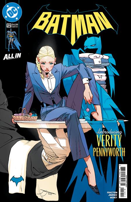 Batman comic book cover featuring a blonde woman in a blue suit seated at a table, with Batman in a blue cowl behind her. The DC logo appears in the top left, the title BATMAN is large at the top, and text reads 'Introducing Verity Pennyworth'.