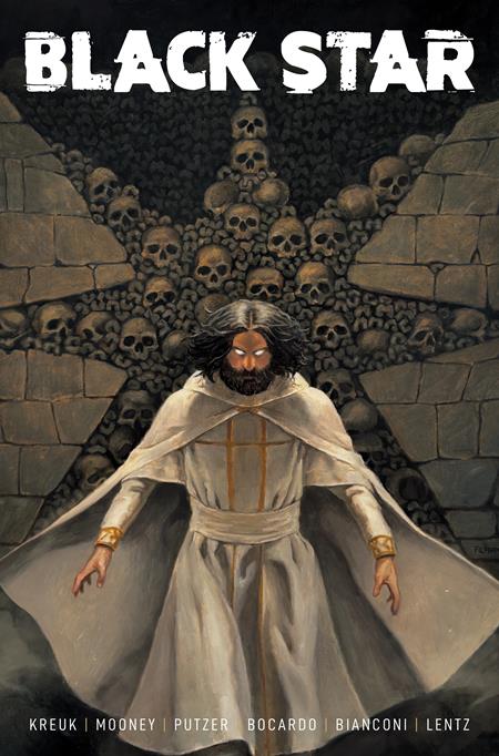 Black Star #4 Cover C Lucas Filippi Variant featuring a mysterious bearded figure in flowing white robes with glowing orange eyes standing before a towering wall of human skulls inside a dark stone chamber.