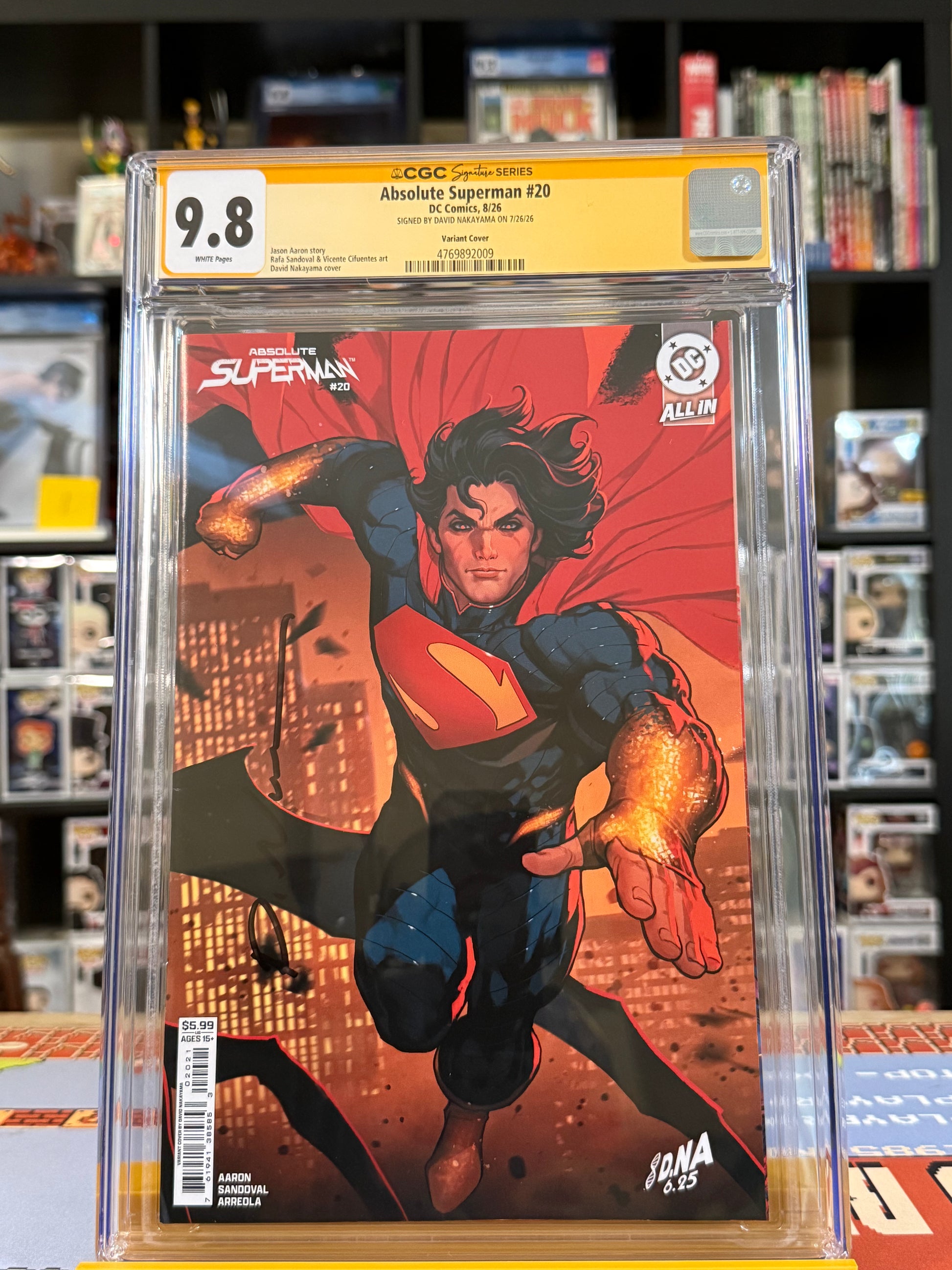 Absolute Superman #20 Cover B David Nakayama Connecting Card Stock Variant, CGC Signature Series 9.8 Yellow Label, signed by David Nakayama, featuring Superman flying forward with glowing golden arms against an orange-lit city skyline,