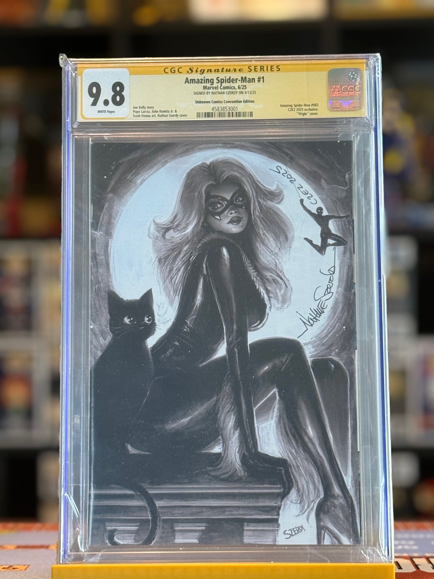 High-resolution image of Amazing Spider-Man #1 C2E2 Black & White Black Cat Virgin Variant, featuring Nathan Szerdy’s monochrome artwork of Black Cat in a seductive dynamic pose. The comic is encased in a CGC Signature Series Yellow Label 9.8 slab, with Szerdy’s autograph visible on the cover.