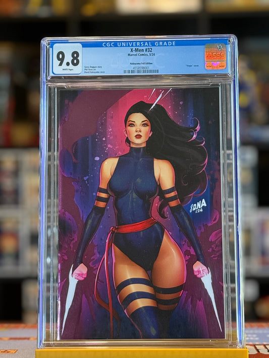 Image shows X-Men #32 graded CGC 9.8 in a sealed slab. The cover features Psylocke illustrated by David Nakayama in a dynamic pose, highlighted with metallic spot foil across the artwork. Virgin variant—no trade dress—allowing the full art to stand out.